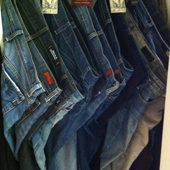 Hang your jeans on shower hooks to make them more assessable.