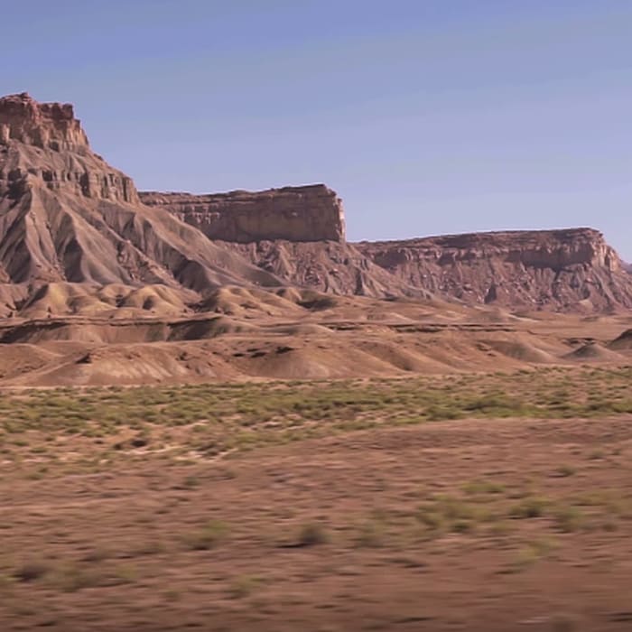 Watch a train roll through the desert for an hour
