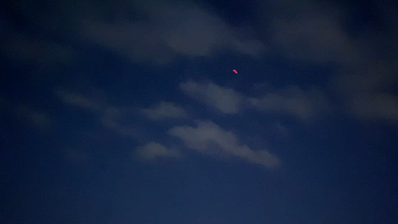 UFO sighting in Florida. Fast-moving red light and two stationary orbs