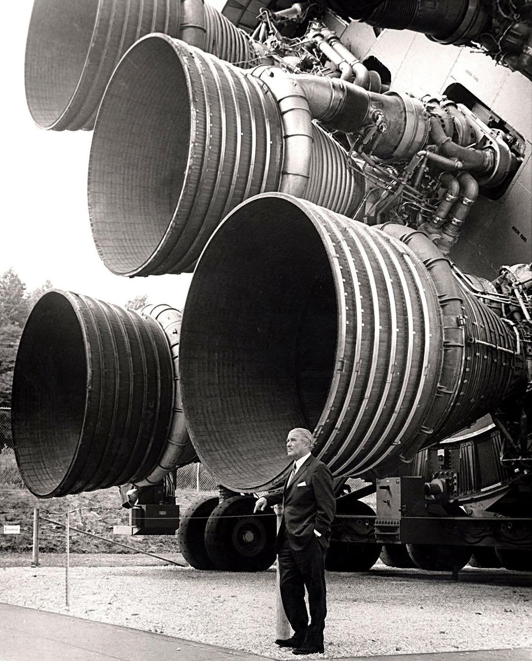 Aerospace engineer Werner von Braun with the enormous F-1 booster rockets of the Saturn V at the Kennedy Space Center in 1967.