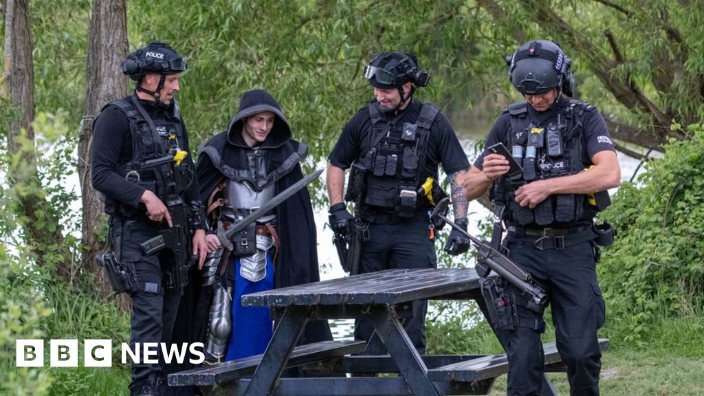 Armed police were called after a man dressed as a medieval knight with a 3ft sword was spotted out for his daily exercise.