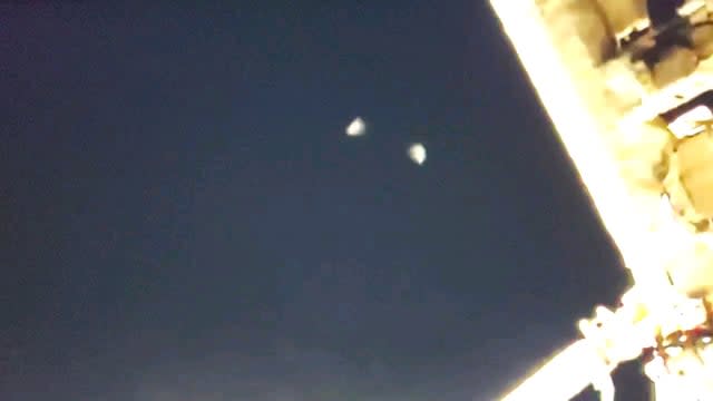 Weird ufo seen from the international space station; splitting into 2 and coming back together then dissappearing. Captured on November 22, 2020