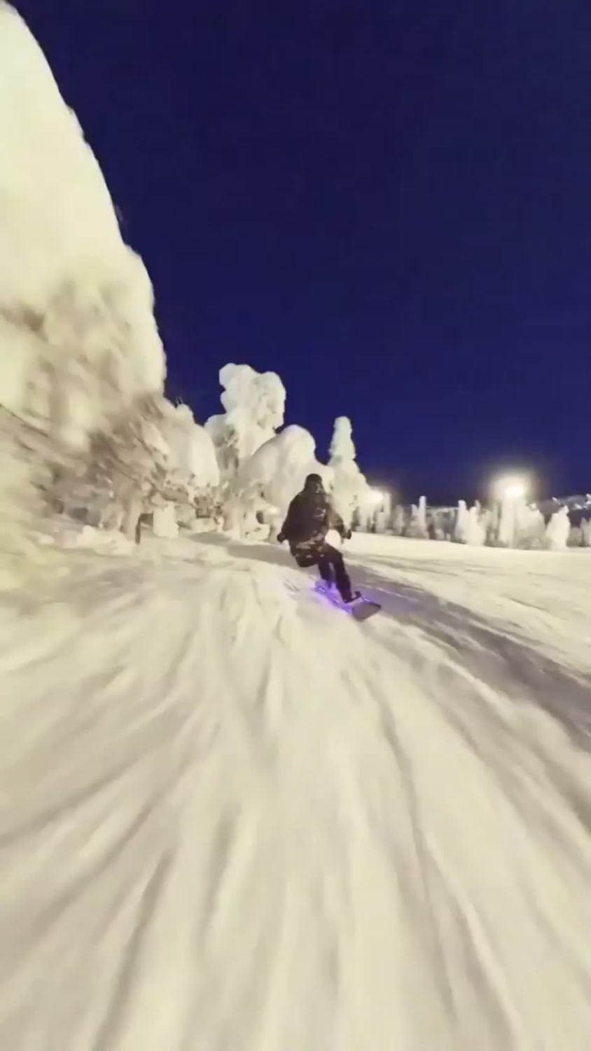 Snowboarding at night in Finland