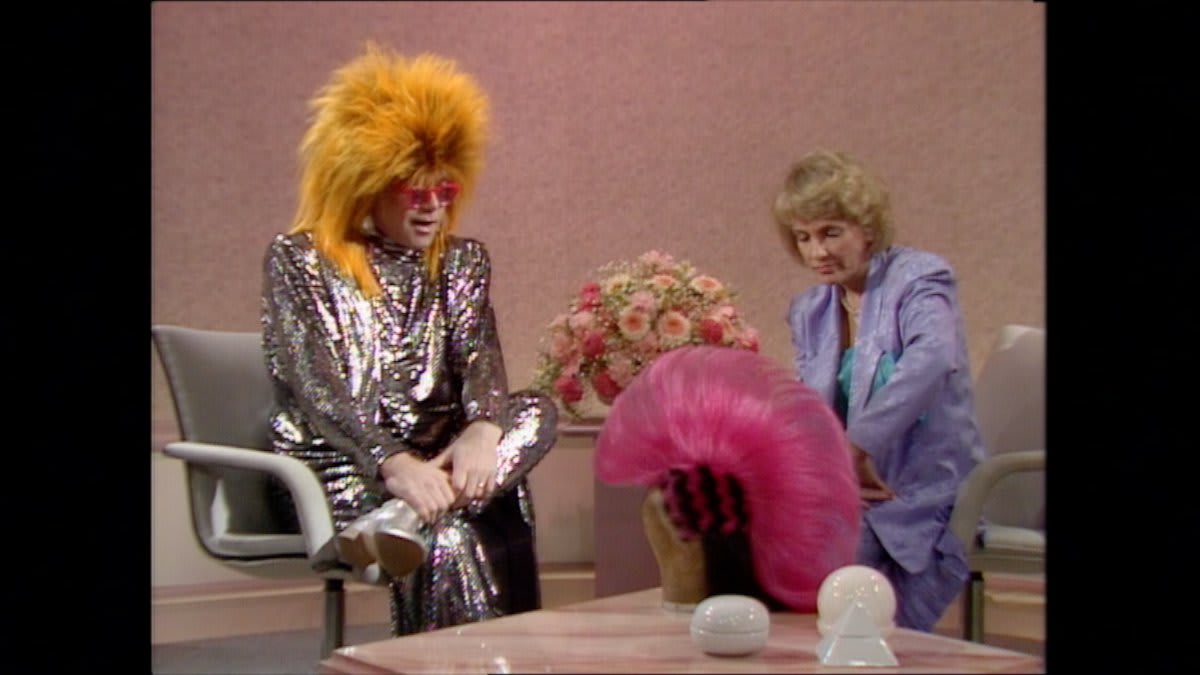 OnThisDay 1986: An angelic Elton John talked wigs and gigs with Esther Rantzen on Wogan.