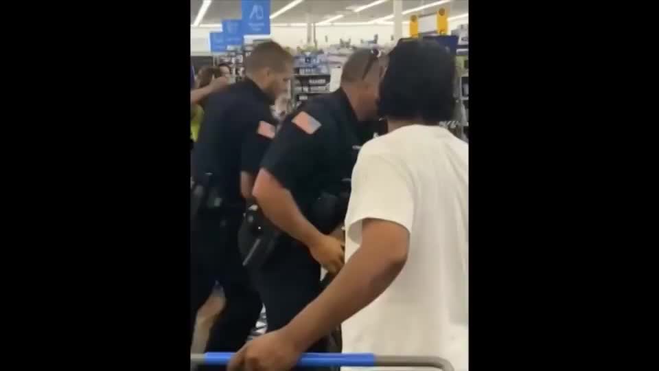 Woman tries to bite cop then gets punched