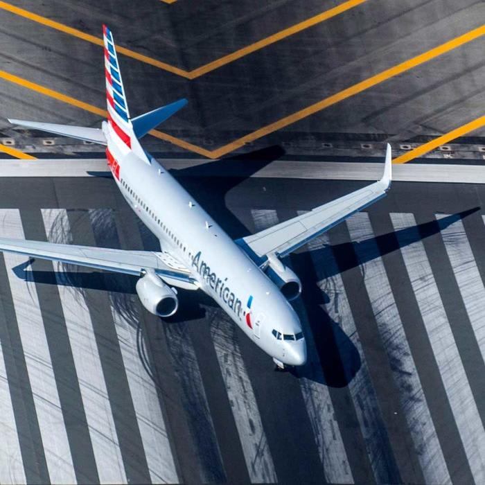 American Airlines Flight Attendant Claims Coworker 'Choked, Dragged' Her in the Aisle With Her Scarf (Video)