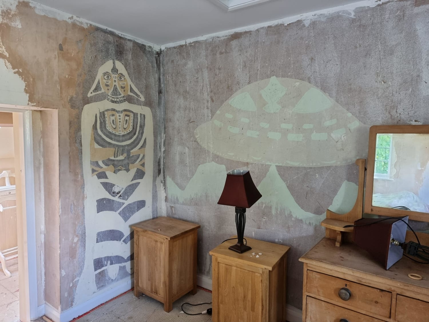 A strange mural found after removing the paint in my aunt's new house