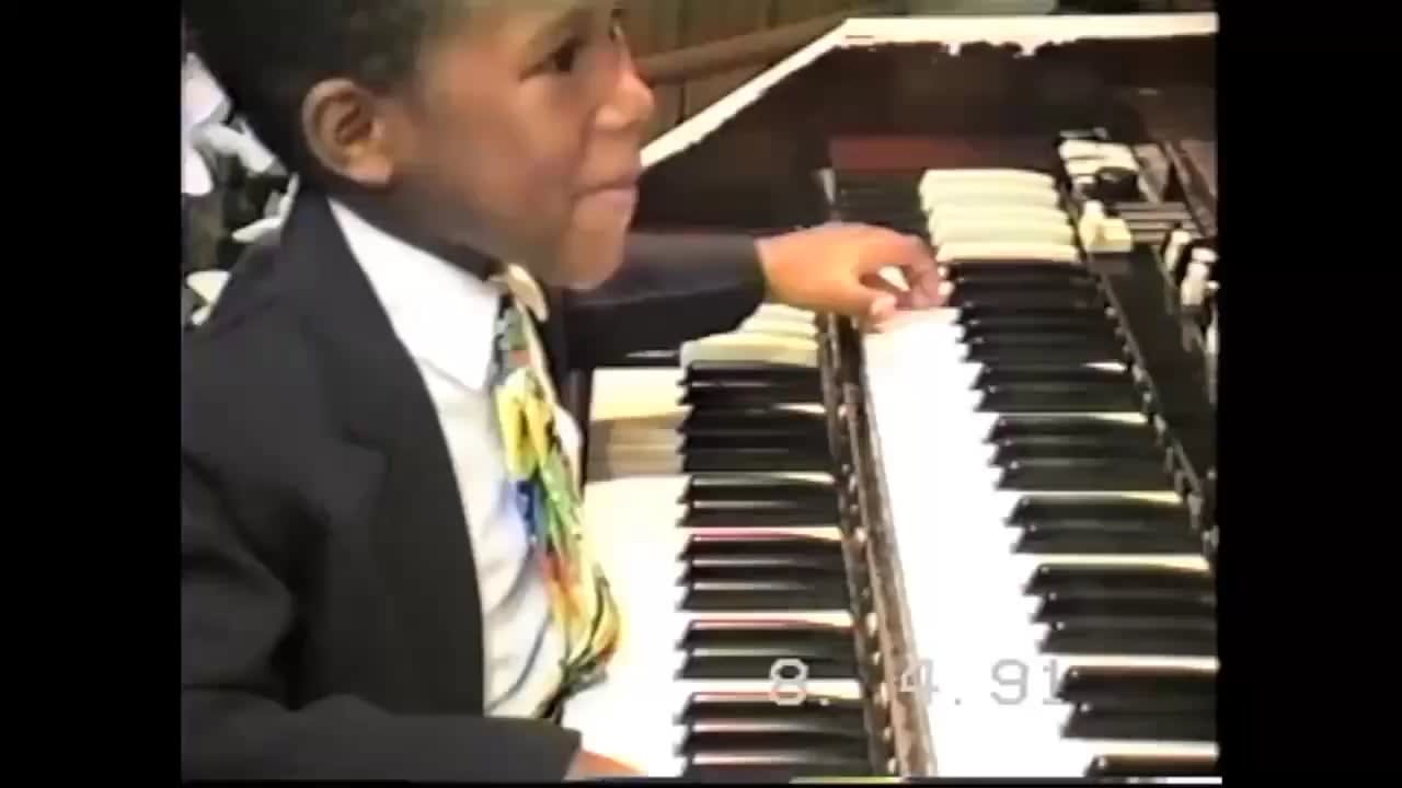 Organist Cory Henry at four years old...