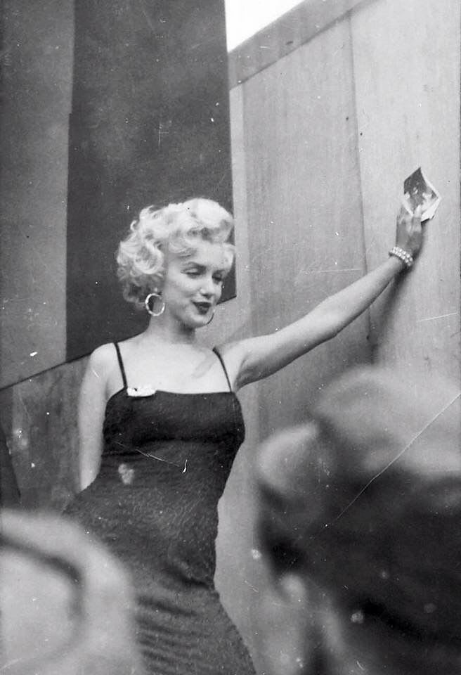 A soldier's polaroid of Marilyn Monroe visiting the troops in Korea: "She was the most beautiful, refreshing sight most of those men had seen in months." (1954)