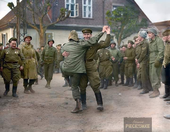 Soviet and American soldiers share a dance upon their meet-up at the River Elbe near Torgau, Saxony, Germany. April 26th, 1945.