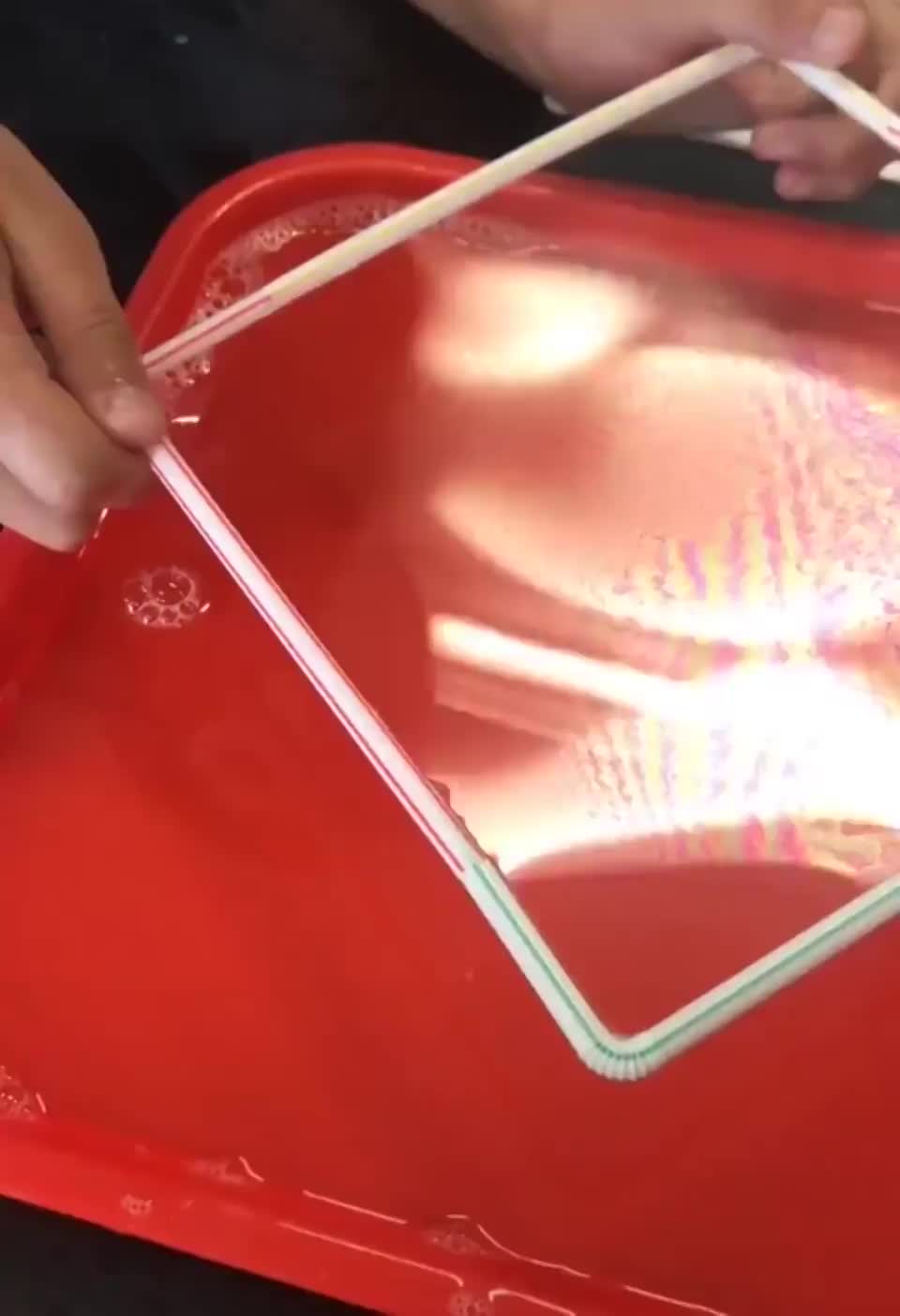 Surface tension pulls the thread into a perfect circle