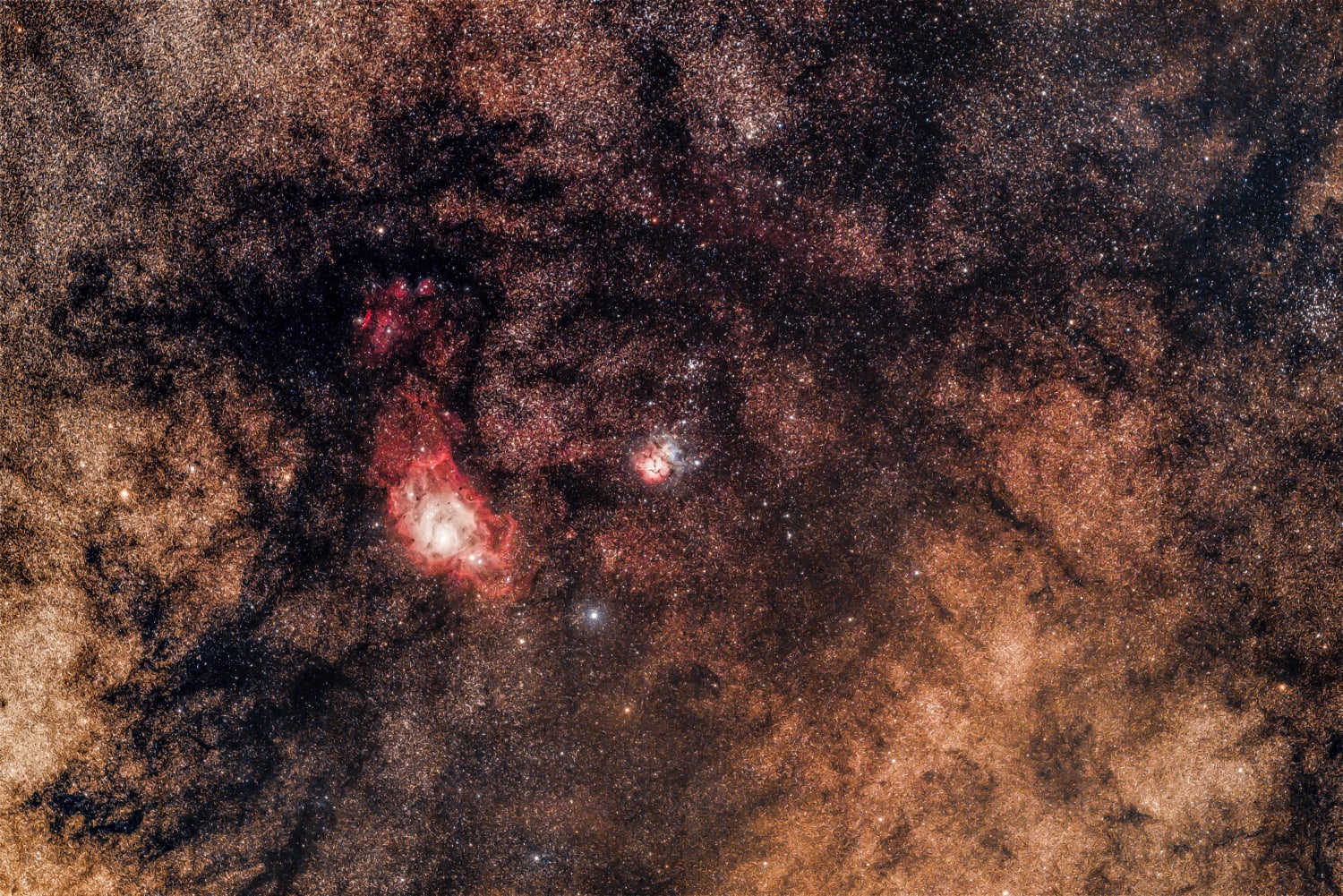 One of my favorite parts of the sky. The Lagoon nebula and Trifid nebula, surrounded by pretty interstellar dust. A little over an hour worth of data taken from Al Sadeem Observatory, Abu Dhabi, UAE.