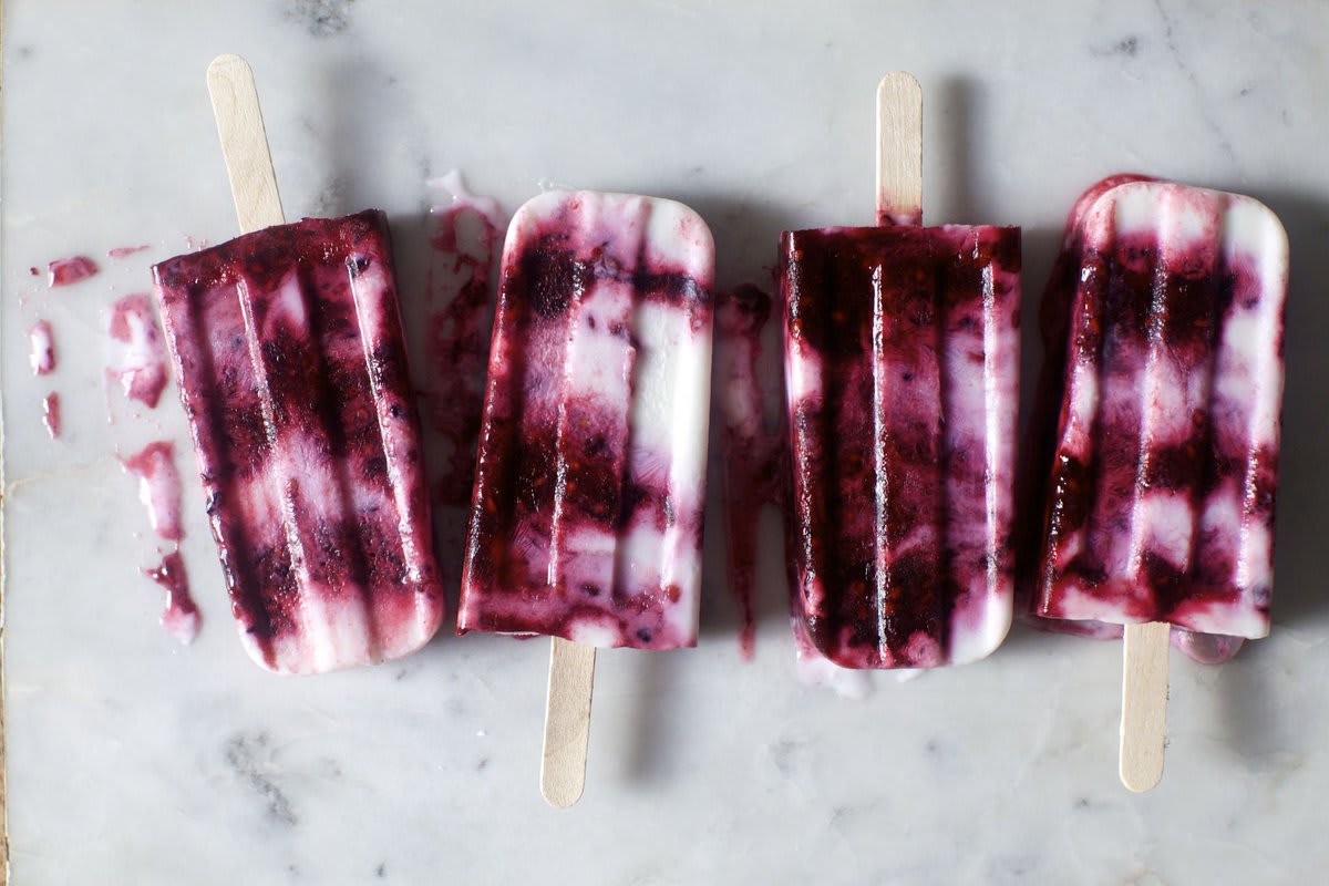 Barely sweetened greek yogurt and berries half-cooked to collapse gently marbled then frozen in place for all the warm days ahead. Let's make breakfast popsicles a thing.