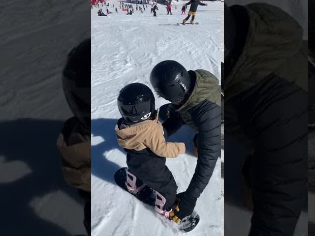 Toddler Learns Snowboarding From Dad and Grandpa - 1136680