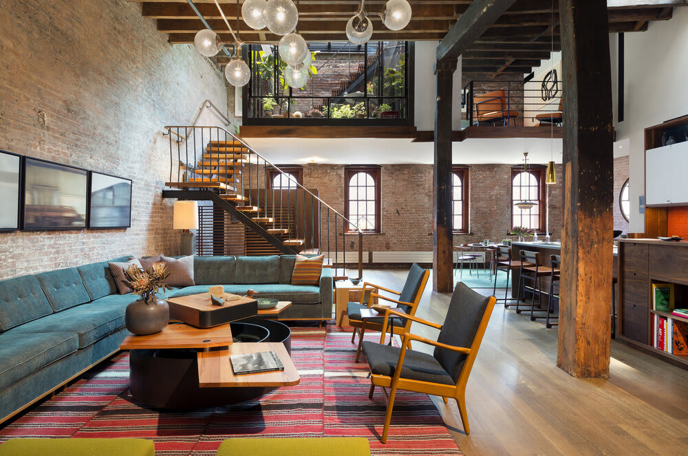 Loft in a former caviar warehouse in Tribeca with a sunken interior court connecting the garden above through a retractable glass roof