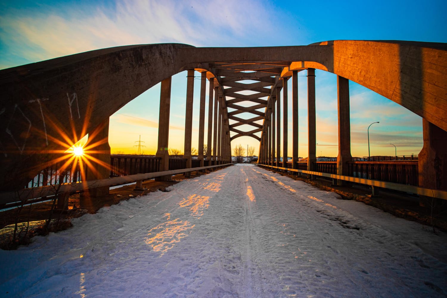 An abandoned bridge in Saskatchewan, Canada at sunset
