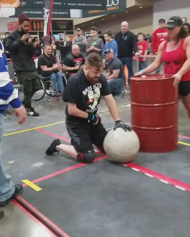 Handicapped man doing the Atlas Stones at Arnold Schwarzenegger’s Disabled Strongman competition