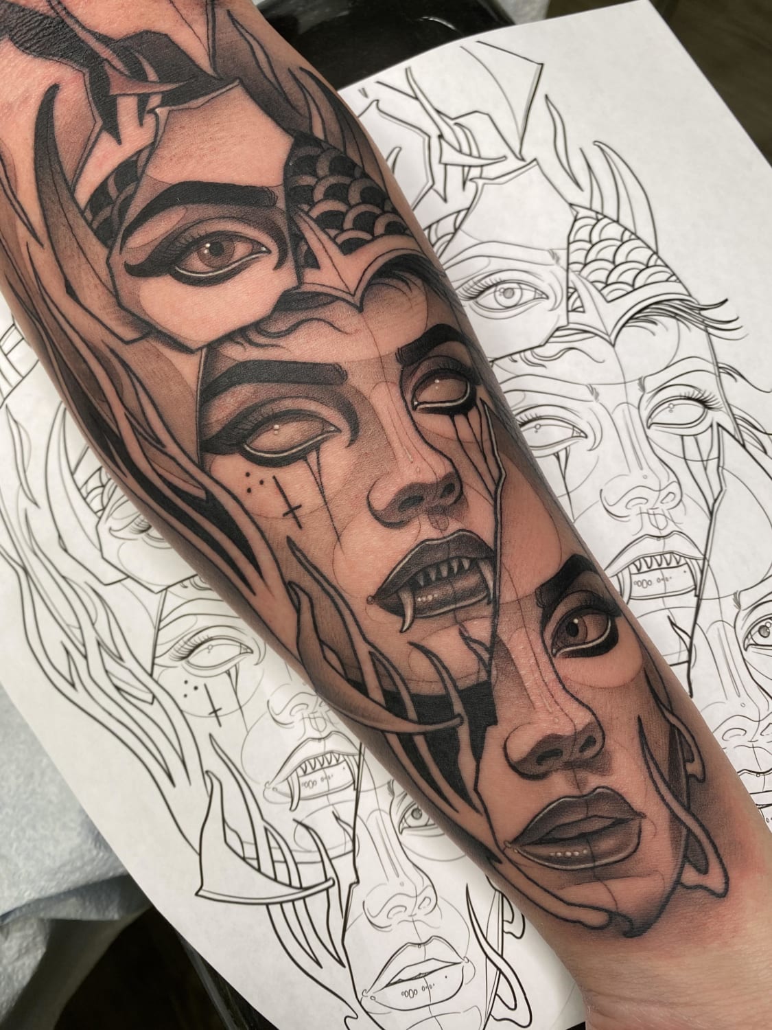 Human face breaking off from demon face by Gian Karle at Seven Horses Tattoo, NH