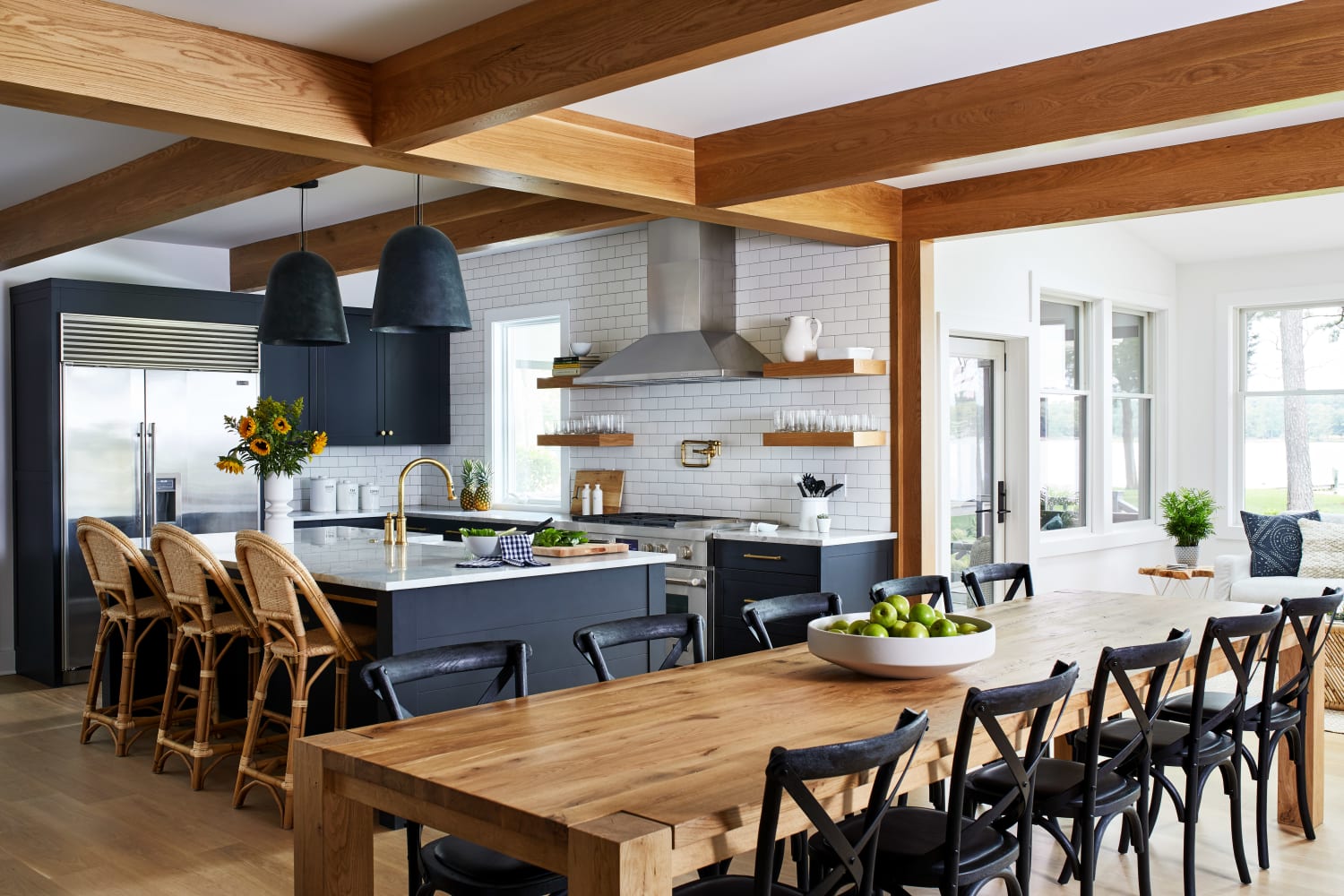 Kitchen and dining with wooden beams in a renoavted farmhouse-style residence, Eastern Shore of Maryland