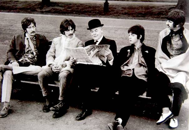 The Beatles sitting with an elderly man (1967)
