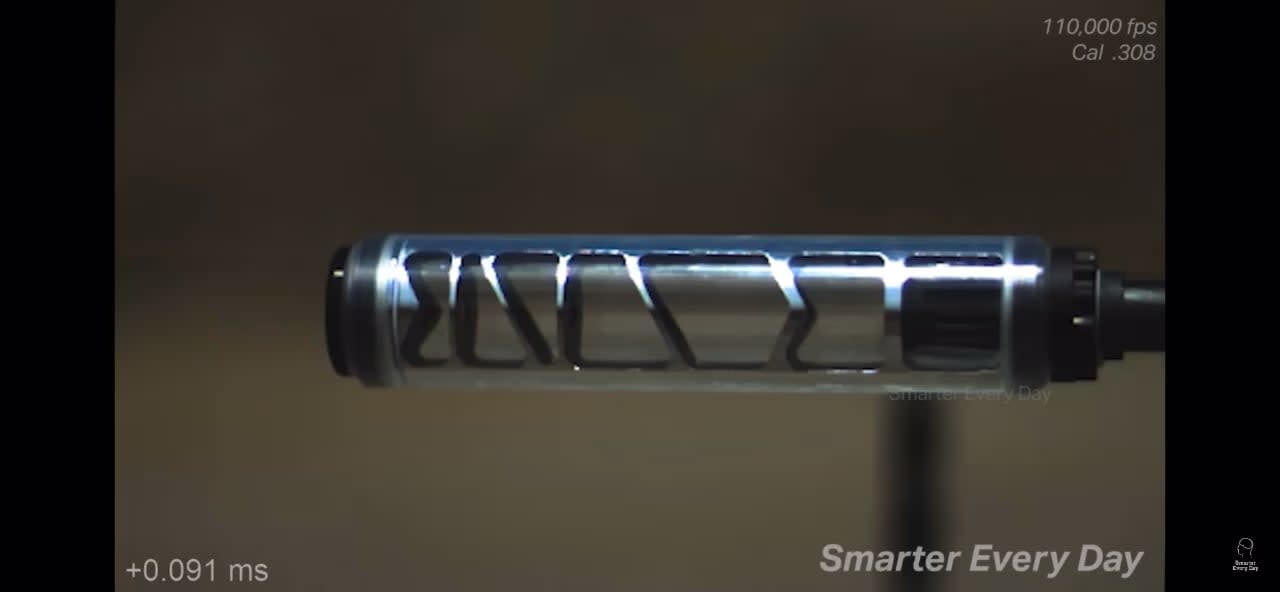 Shooting a gun with a see-though suppressor in super slow motion