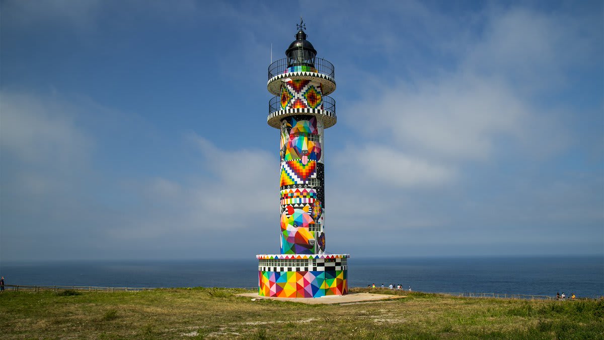 Okuda San Miguel transforms a stark lighthouse in Spain into a technicolor beacon