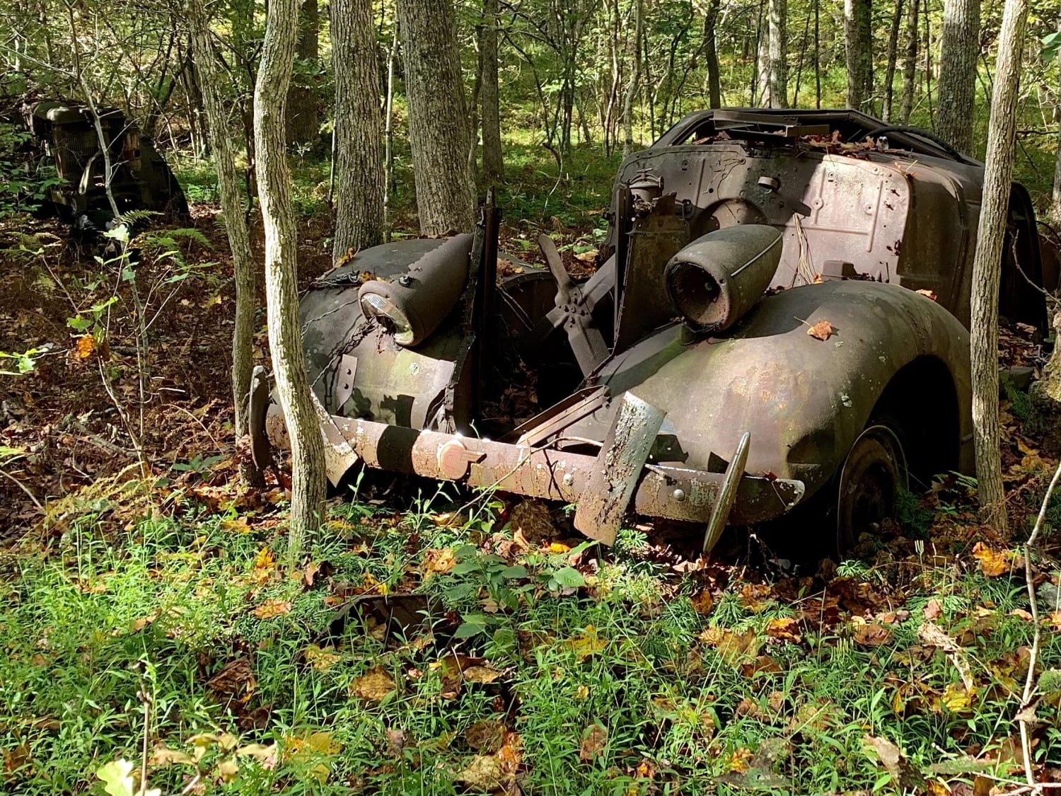 Late 30s Pontiac left in the woods a half mile from any road. I wonder how it got there.