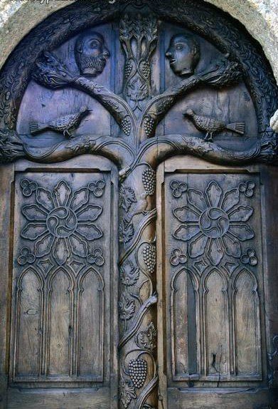 The beautiful wooden door of the ossuary (1667). Lampaul-Guimiliau, Finisterre, Brittany, France, Europe | Cool doors, Unique doors, Wooden doors
