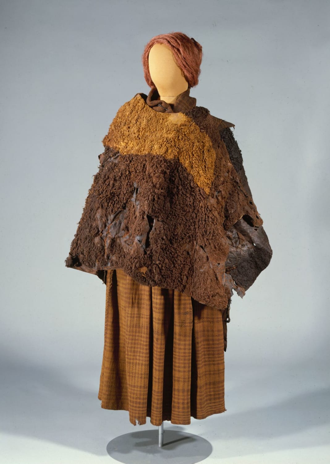 The 2000-year-old clothes of the Huldremose Woman, a bog body recovered in 1879 from a peat bog near Ramten in Denmark. It consists of a checked woollen skirt, a checked woollen scarf and two skin capes. Now on display at the National Museum of Denmark