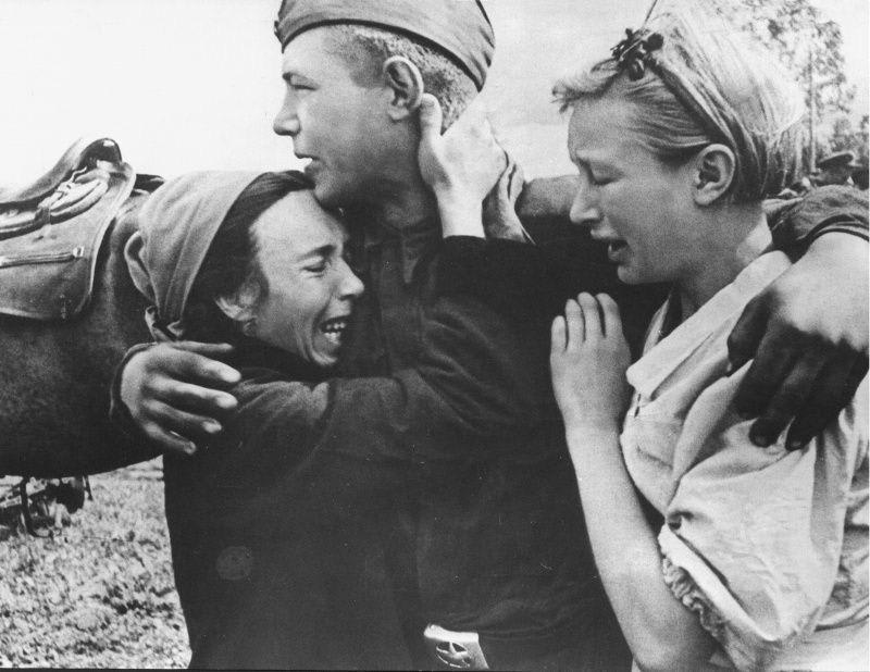 Russian conscript with his family before being deployed to the front, Karachev, Bryansk, Russia, 1943.