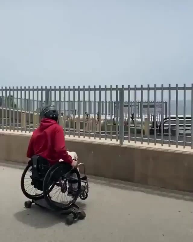 The smooth way he rides a skateboard from a wheelchair