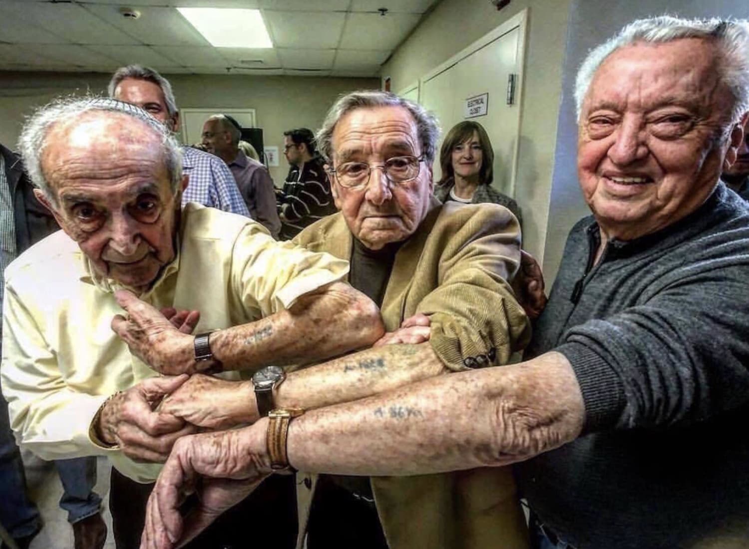 3 Jewish men taken to Auschwitz the same day, tattooed ten numbers apart, reunited 73 years later.