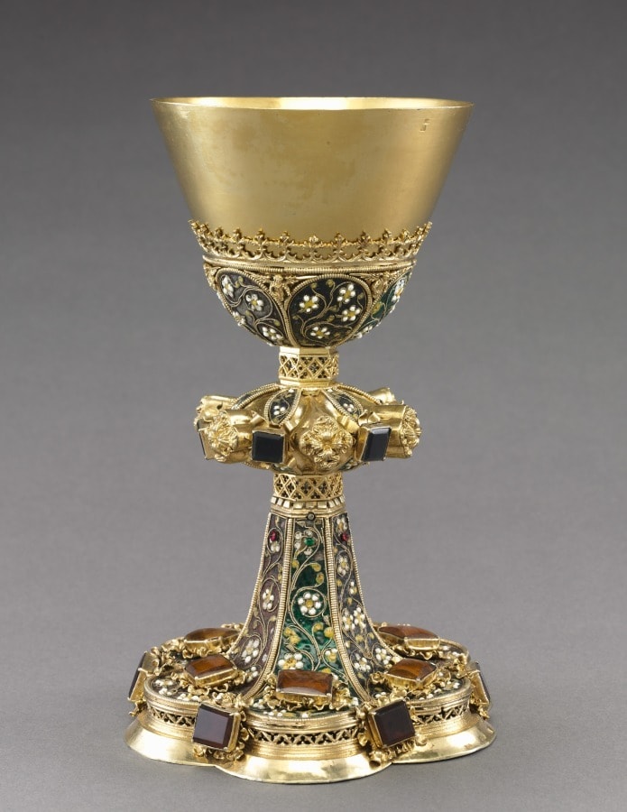 This gilded silver Chalice survives with its original Paten from ca. 1450-1480, filigreed enamel with gold flowers. Cleveland Museum of Art.
