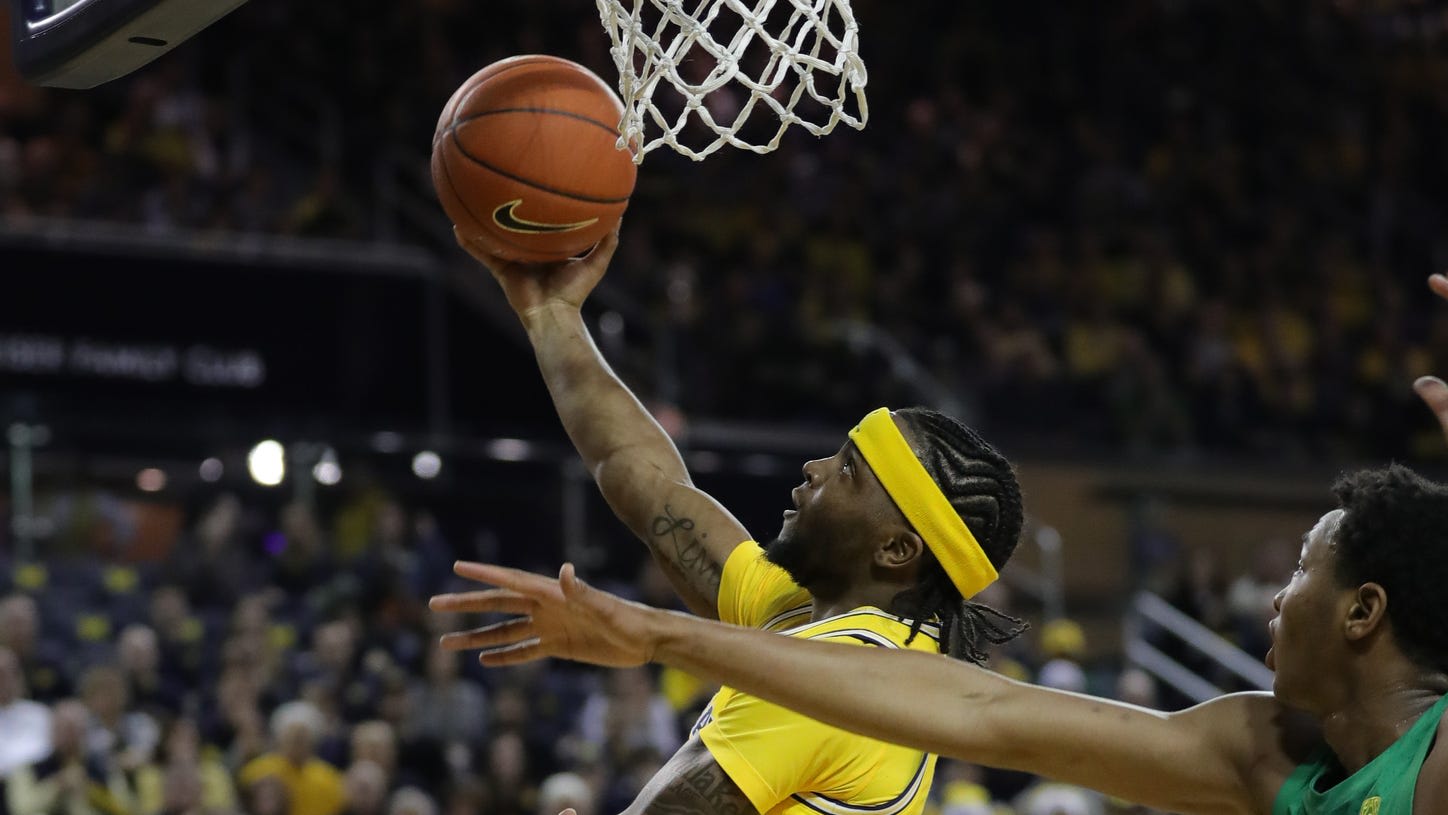 No. 13 Oregon takes down No. 7 Michigan in overtime as Wolverines' tip bounces off rim