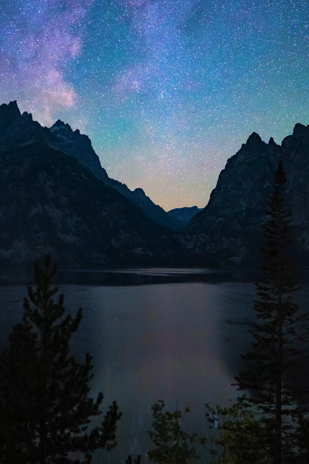 I left my camera running at Jenny Lake (Grand Teton National Park) at night and captured our home galaxy reflecting off the water!
