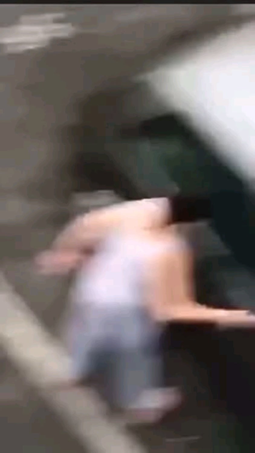 Angry woman attacks car, gets taken out by a dude