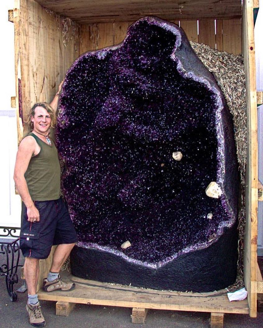 Amethyst geode with human for scale