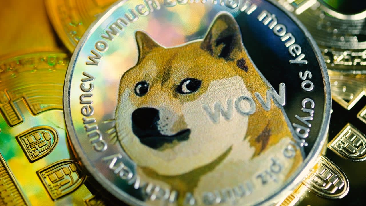 Dogecoin hits record highs as the cryptocurrency begins trading on eToro