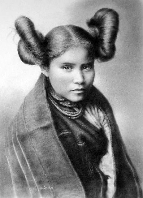 Adolescent Hopi girls wore their hair in the traditional squash-blossom hairstyle to signify their maturity and readiness for marriage.