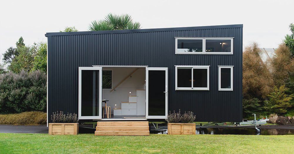 Black-clad tiny home features a not-so-tiny living room
