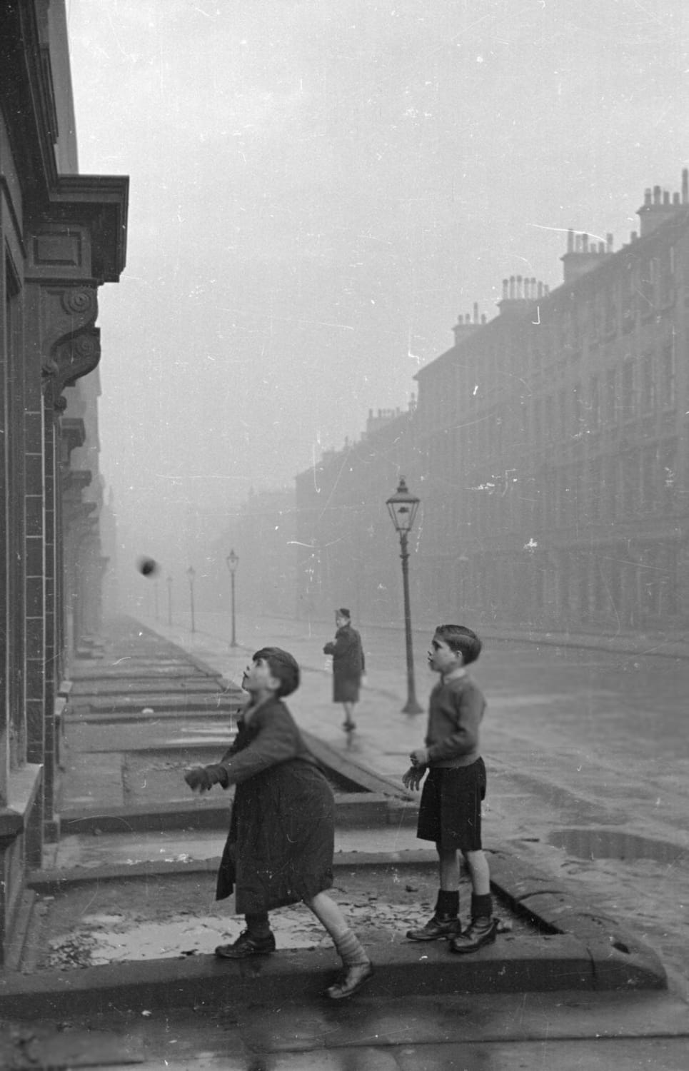 Glaswegian children playing in a street in the Gorbals, 1948, by Bert Hardy.