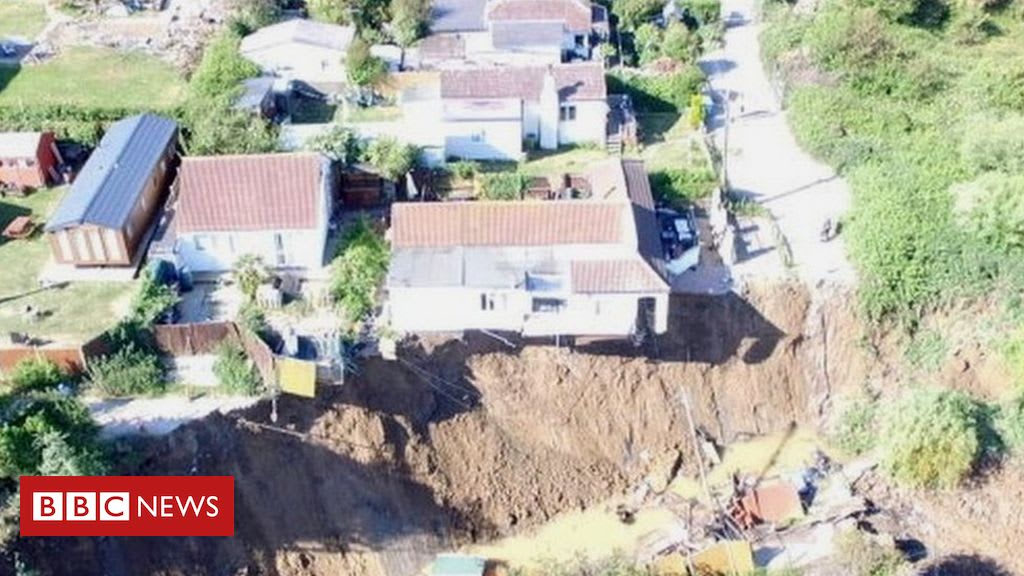 House hanging over cliff after second collapse