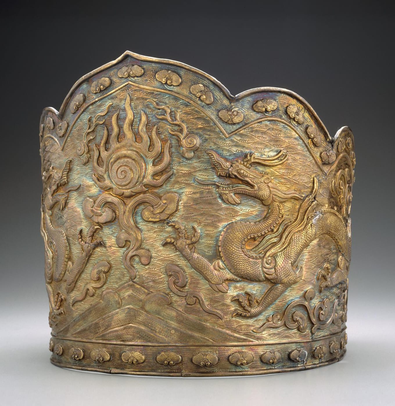 Silver headdress decorated with two dragons and a flaming jewel. China, Liao dynasty, 10th-11th century