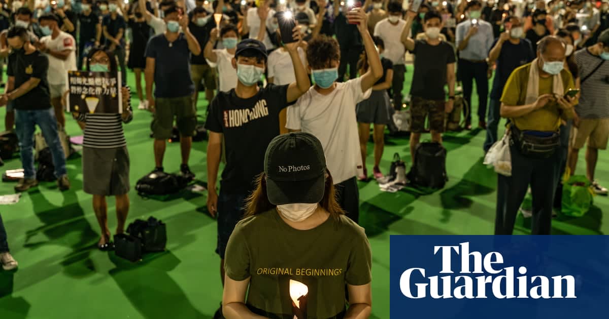 Hong Kong protesters hold banned Tiananmen vigil as anthem law is passed