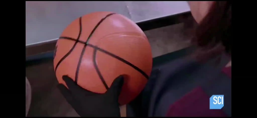Painting the black lines on basketballs...