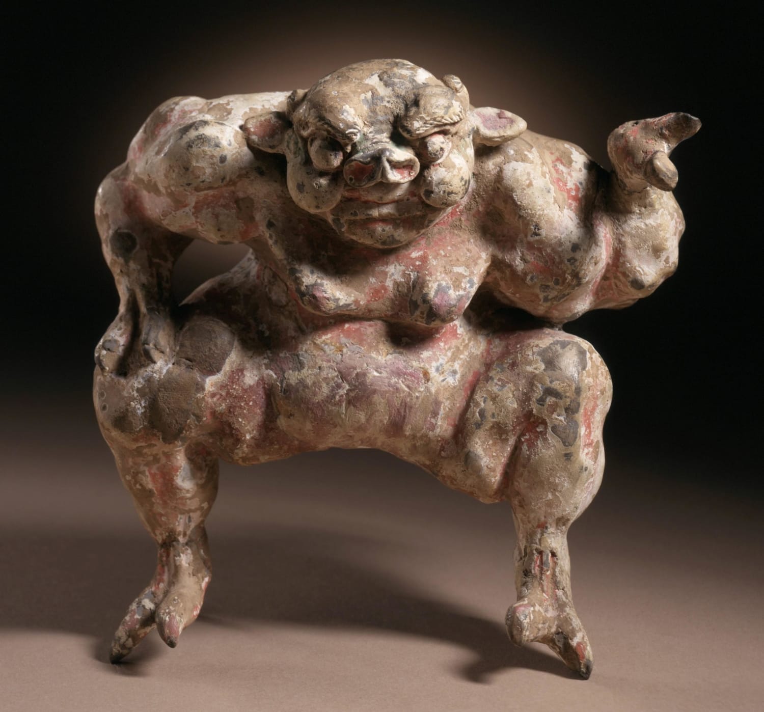 Funerary sculpture of a demon, early Tang dynasty, China, about 618-700, molded earthenware with incised decoration and traces of white slip and paint, now housed at the Los Angeles county museum of art.