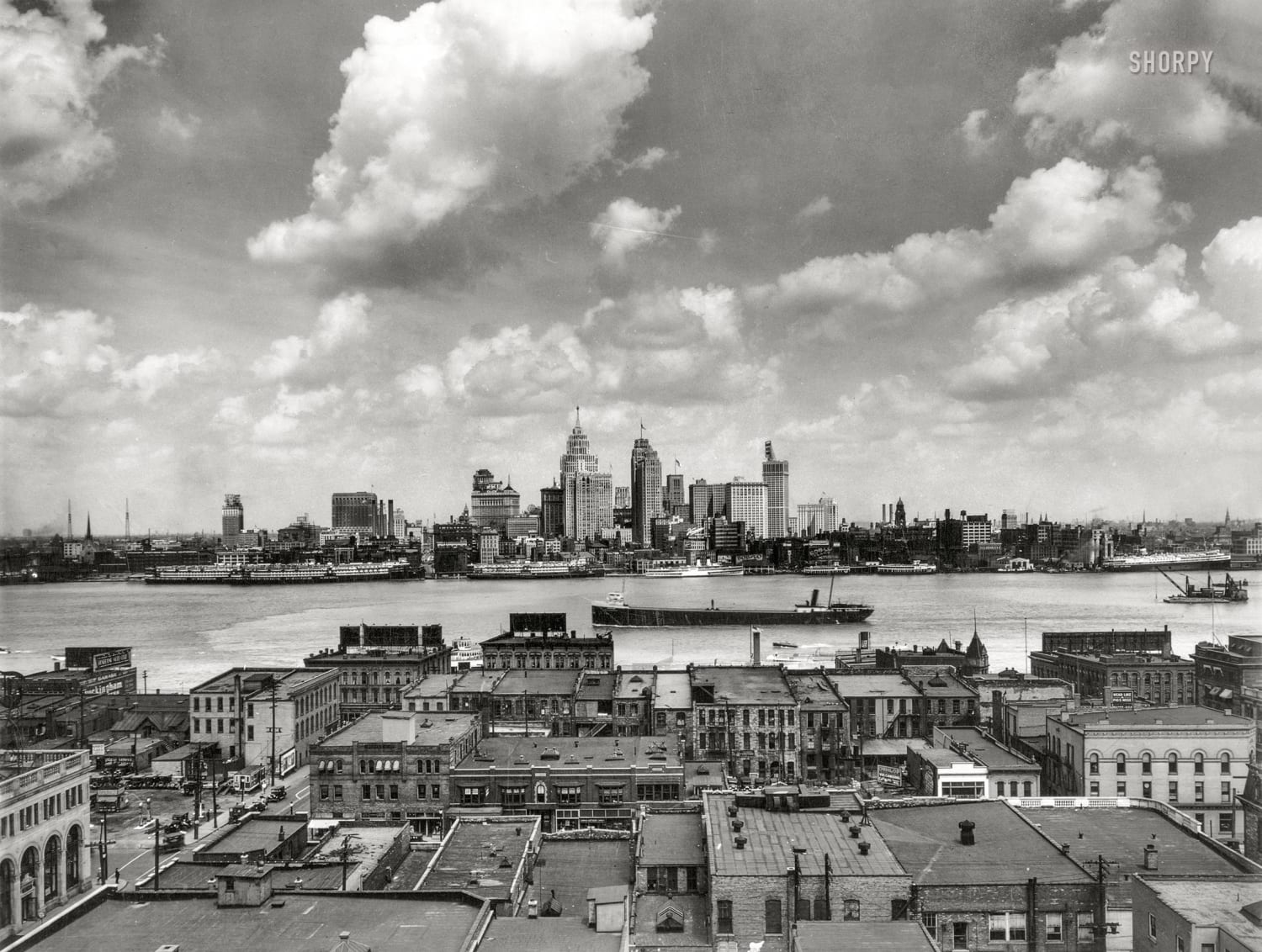 Detroit skyline, with great lakes freighter on the Detroit River, as seen from Windsor, Canada, 1929