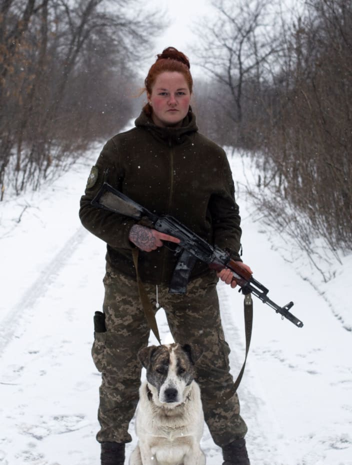 Ukrainian soldier in the 54th Mechanized Rifle Brigade and her adopted dog