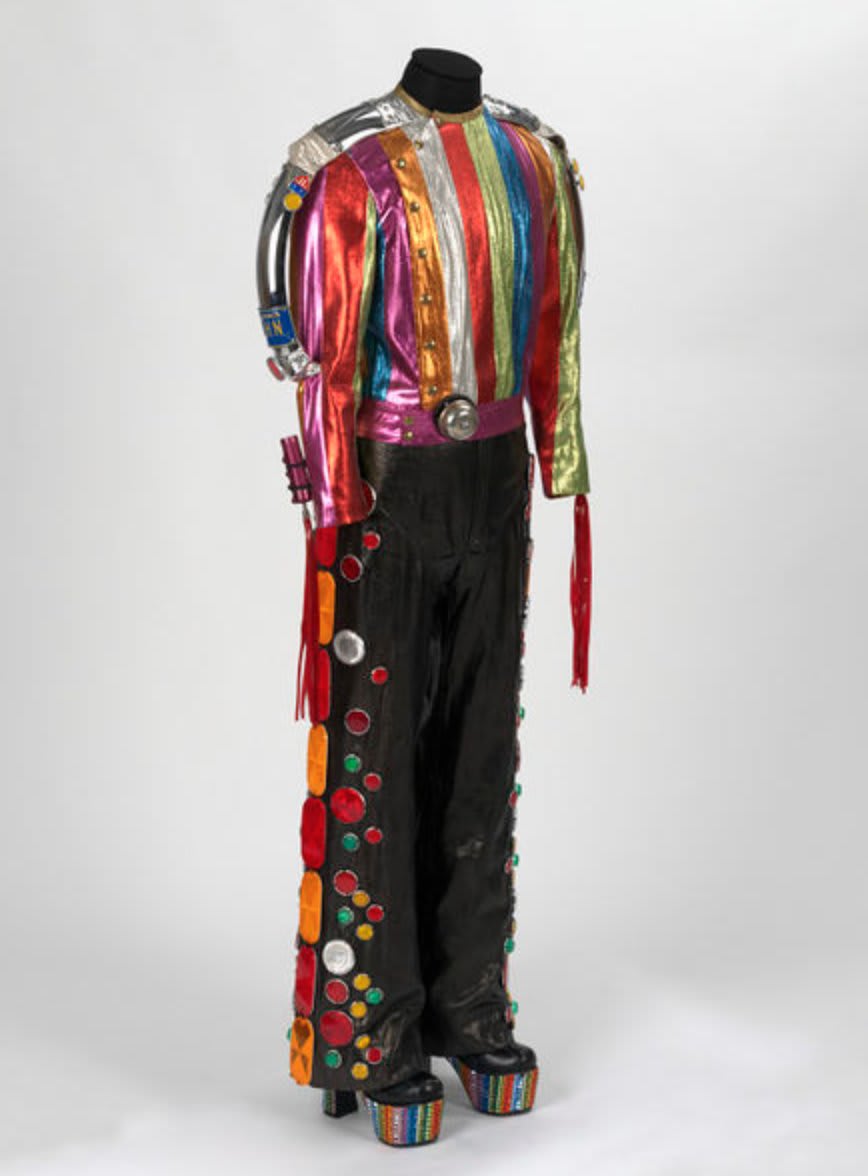 🎶Saturday night's alright alright alright🎶 This flamboyant costume can only belong to the one and only Elton John. Designed by Bill Whitten, this costume was worn it on his 1974 American tour, and is definitely an outfit for the weekend!