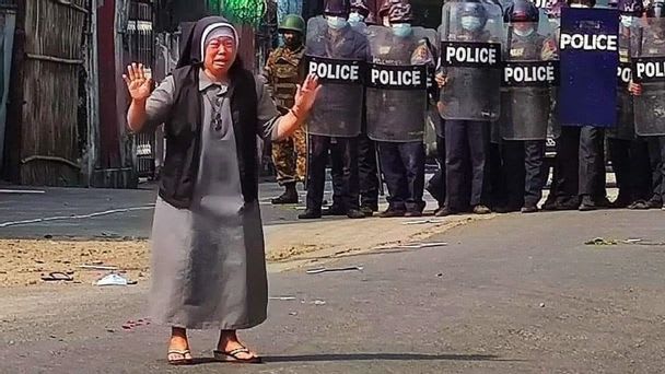 A Burmese nun pleading the police to stop their brutality. She freed 100 protestors from the police.